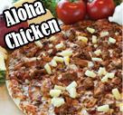 An aloha chicken pizza topped with pineapples, chicken, ham and bacon